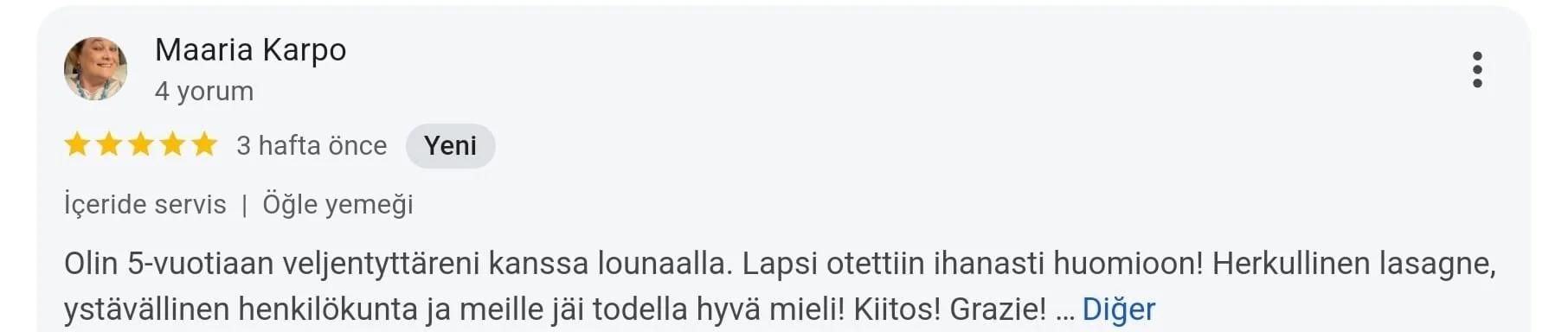 A screenshot of a Google review written in Finnish, praising a lunch experience with the staff, tasty lasagna, and friendly personnel.
