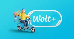 A person in yellow holding a package of groceries while riding a blue scooter against a blue background next to a Wolt+ logo.